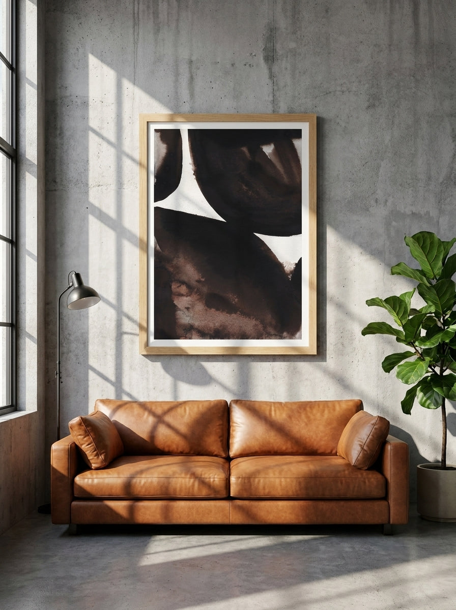 Modern wall art print styled on the wall in an industrial loft living room