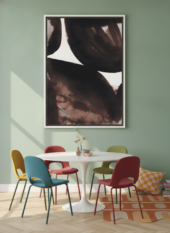 Oversized statement canvas wall art with a white surround styled on the wall in a colourful eclectic dining room
