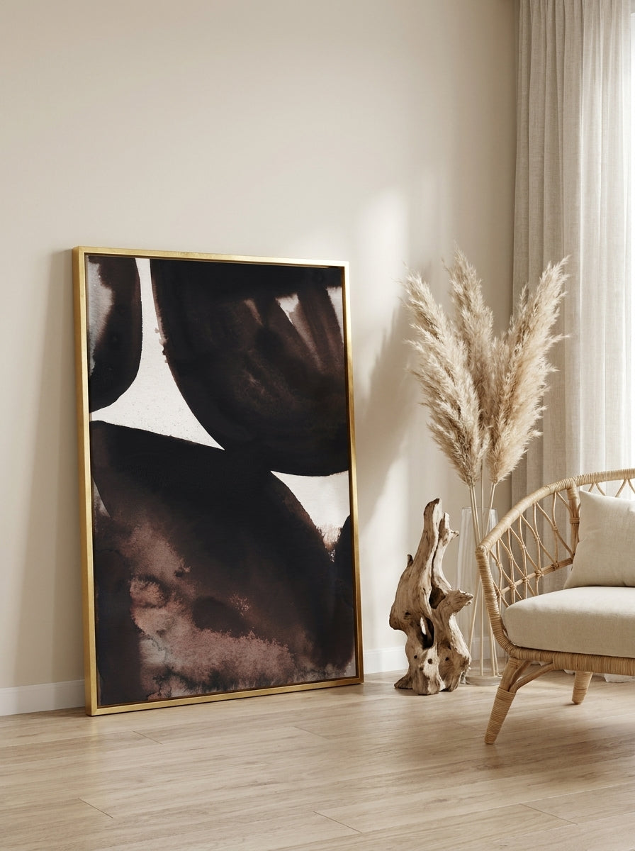 Canvas wall art with a gold leaf surround leaning against the wall in a coastal living room