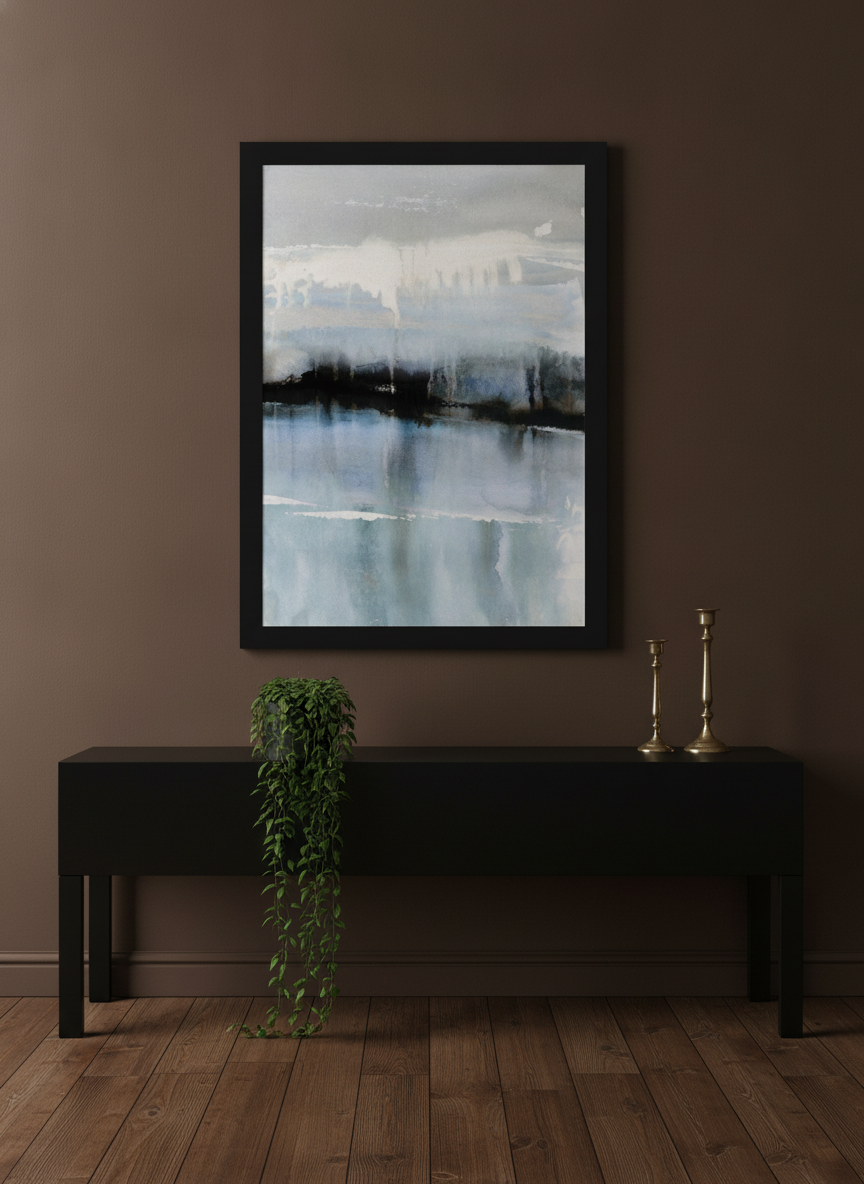 Modern wall art print standing on a console in a moody living room