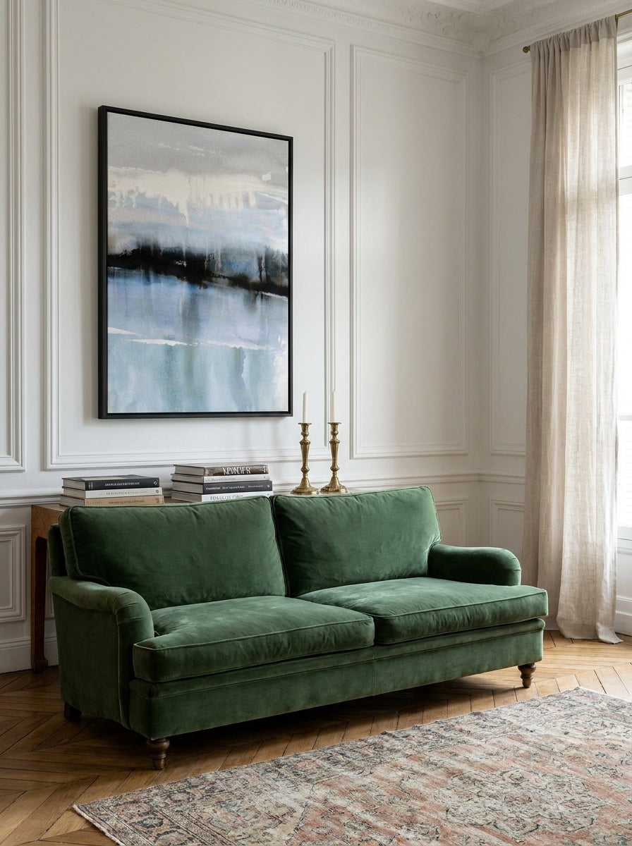 Canvas wall art with a black surround styled on the wall in a Parisian living room