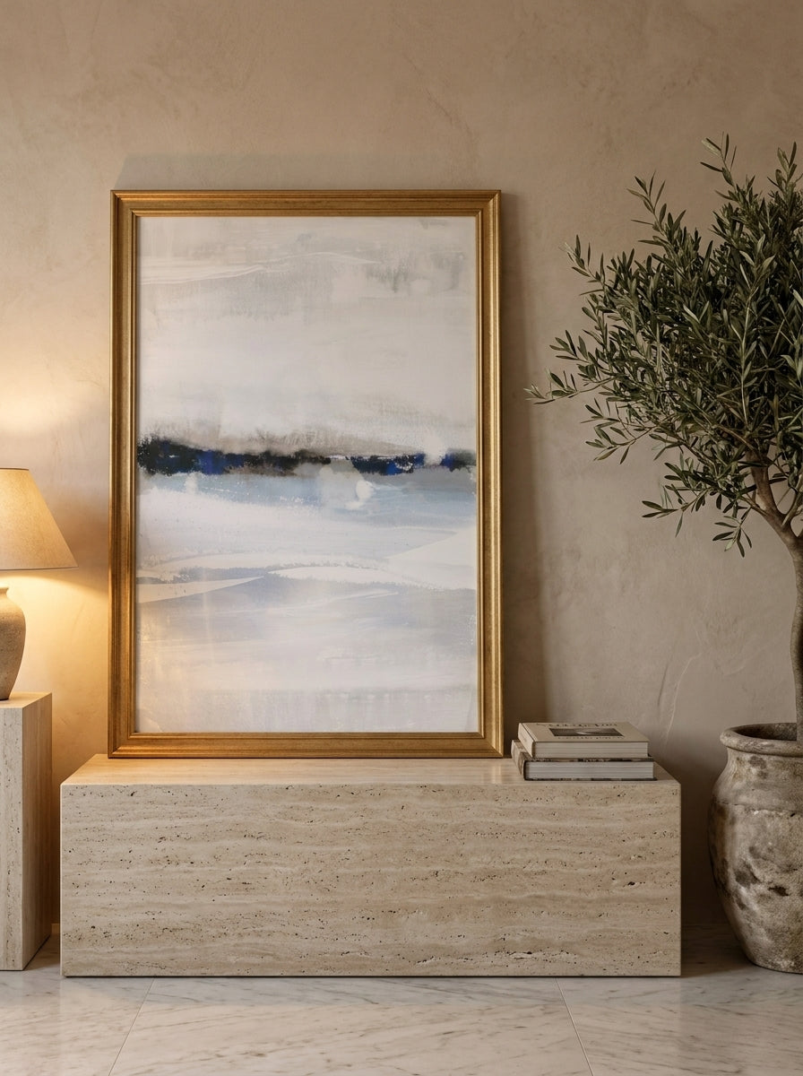 Modern wall art print standing on a console in a luxe bathroom