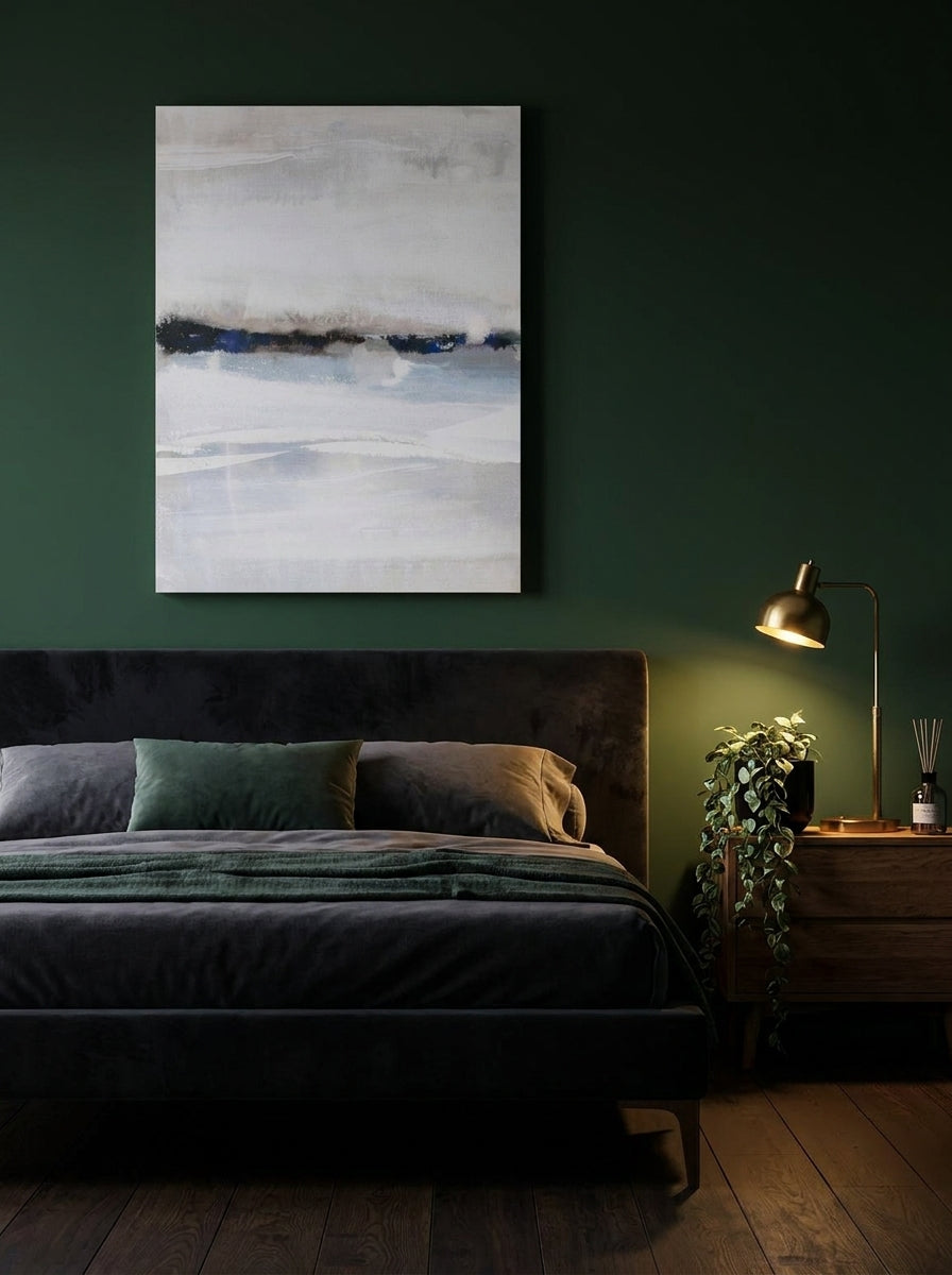 Stretched canvas wall art styled on the wall in a moody bedroom