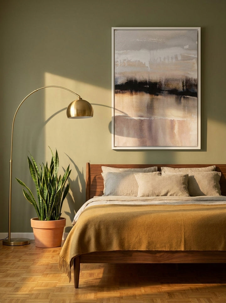 Canvas wall art with a white surround styled on the wall in a mid-century bedroom