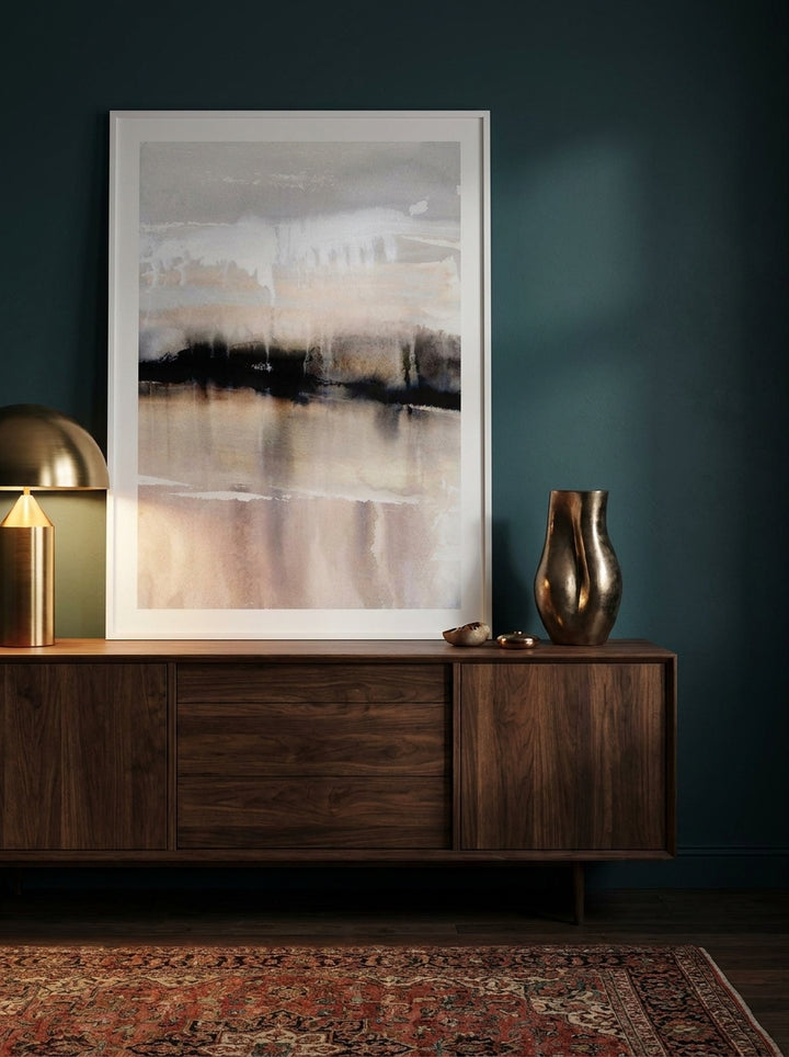 Modern wall art print standing on a sideboard in a moody bedroom