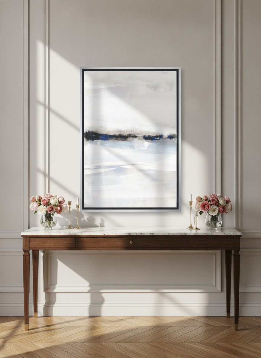 Canvas wall art with a silver leaf surround standing on a console in a Parisian bedroom