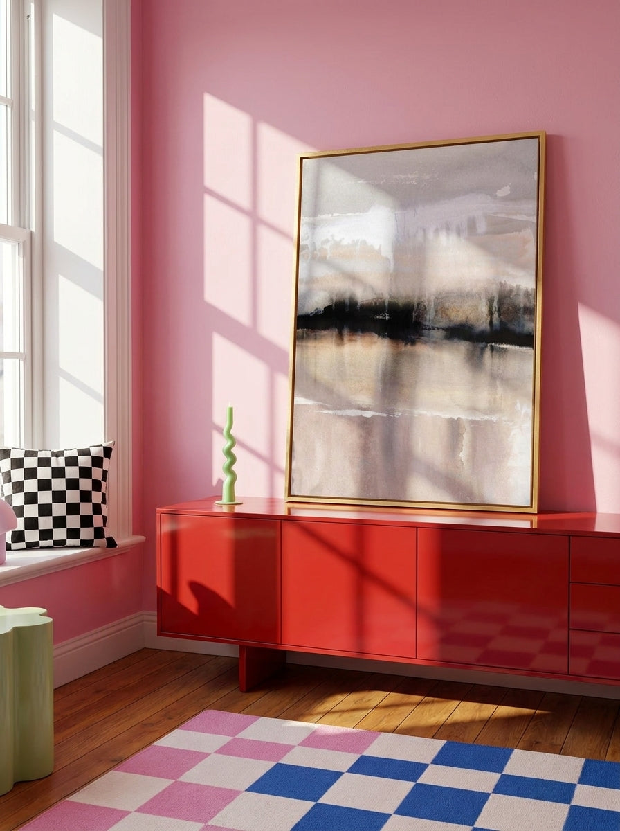 Canvas wall art with a gold leaf surround standing on a sideboard in a colourful eclectic home office