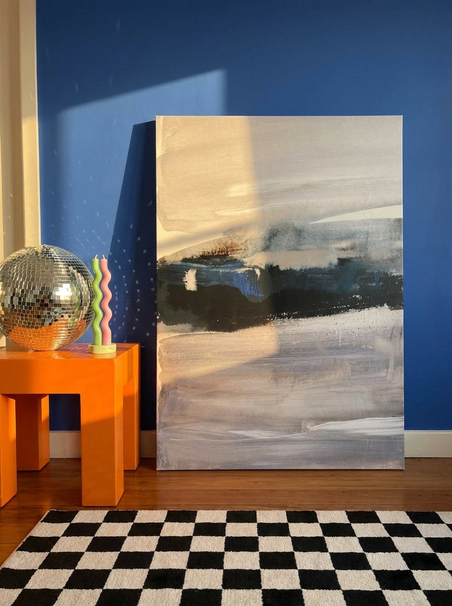Stretched canvas wall art standing on a side table in a colourful eclectic bedroom