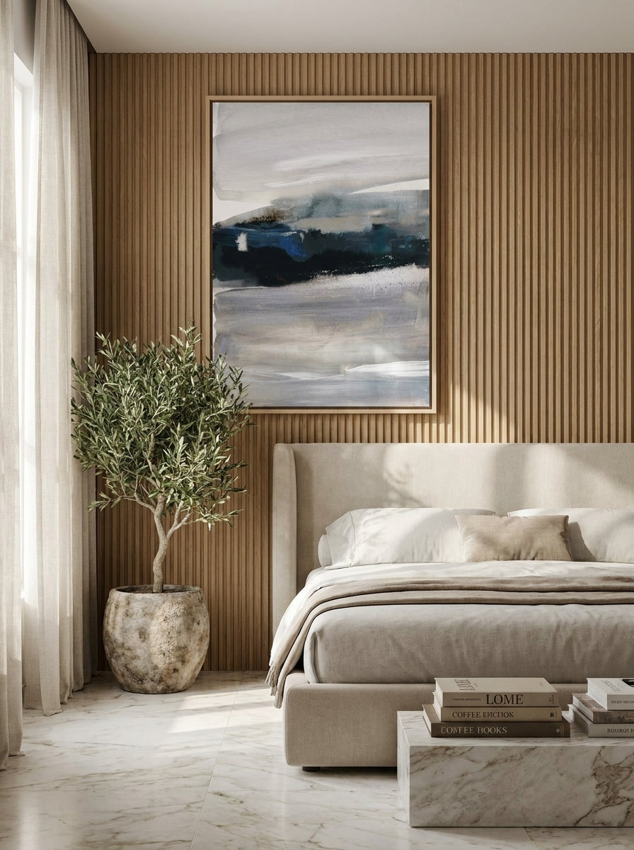 Oversized statement canvas wall art with a natural timber surround styled on the wall in a luxe bedroom