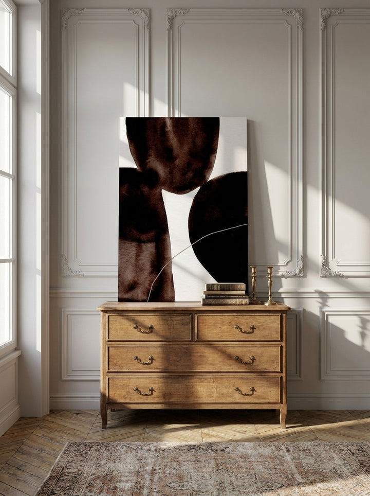 Stretched canvas wall art standing on a sideboard in a Parisian bedroom