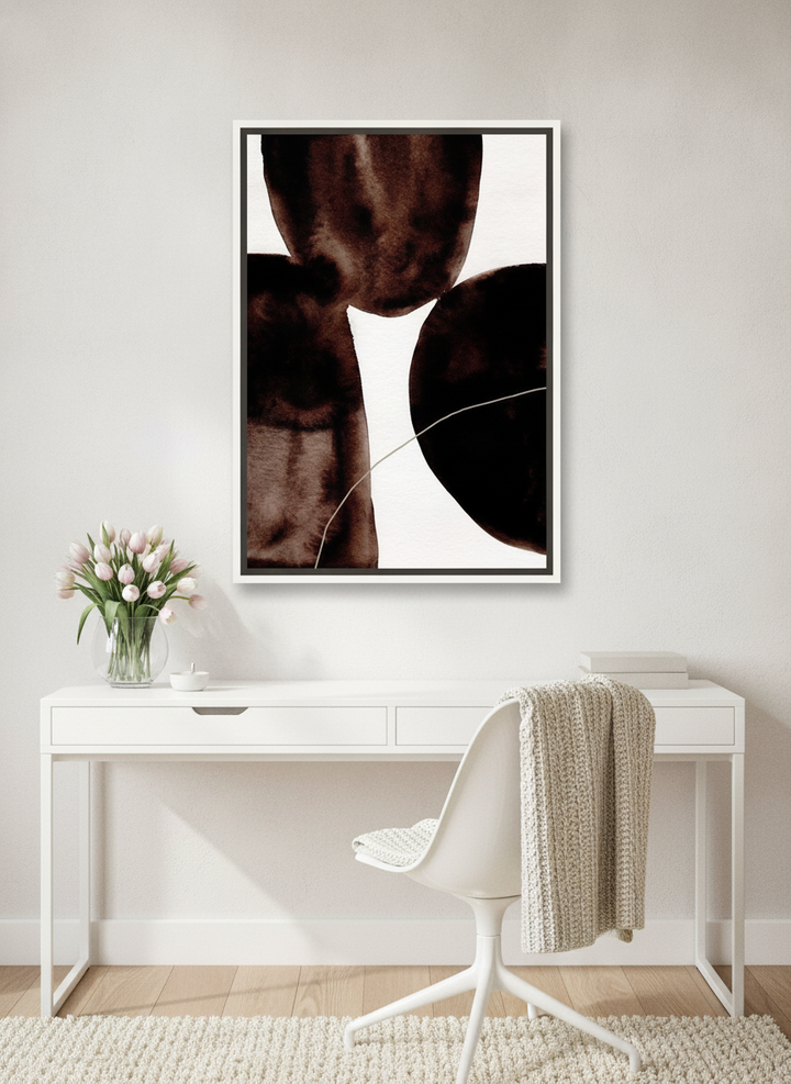 Canvas wall art with a white surround styled on the wall in a bright Scandinavian home office