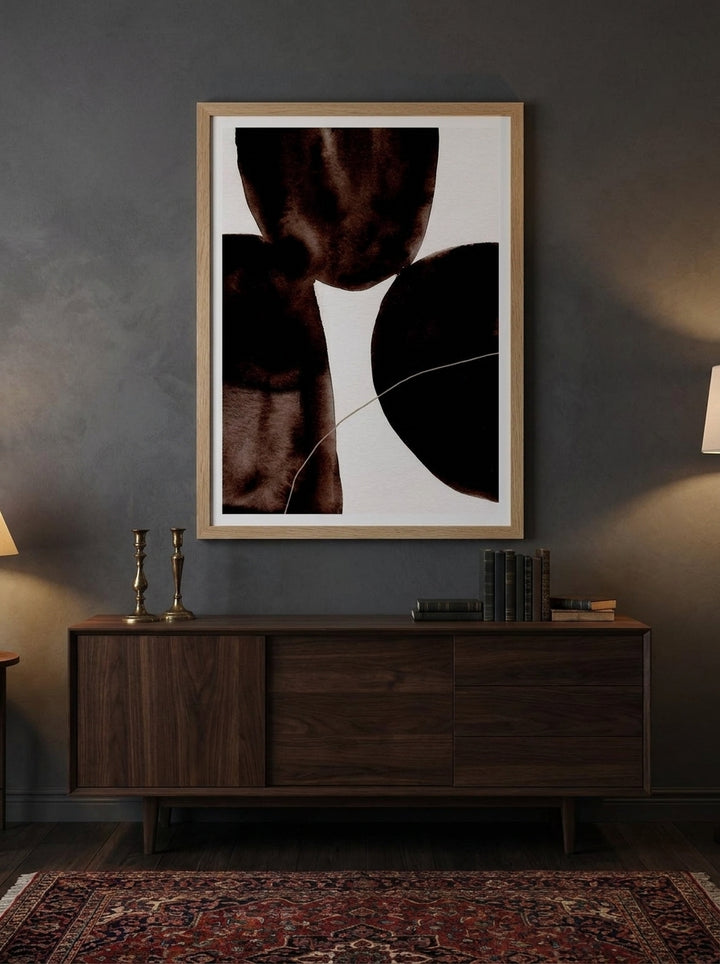 Modern wall art print styled on the wall in a moody living room