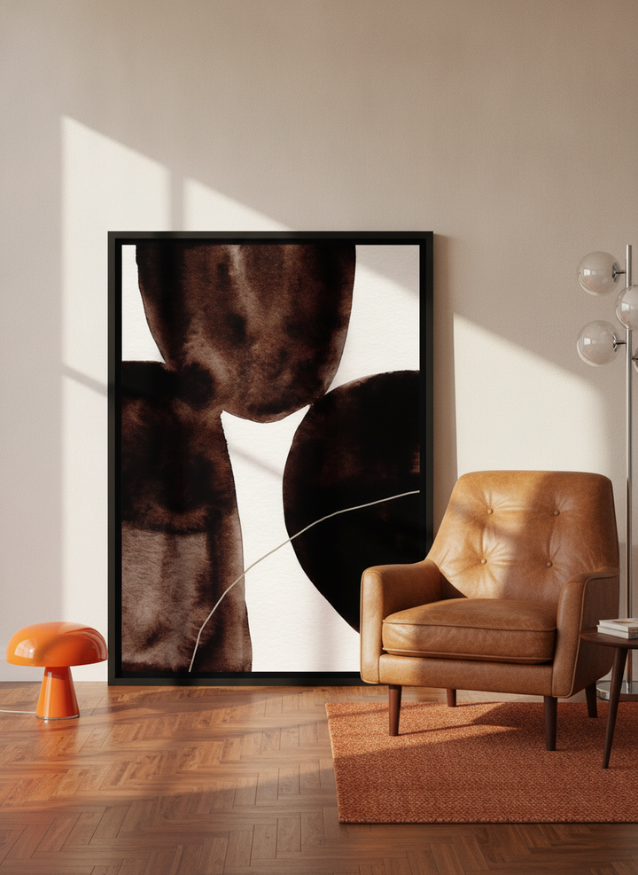 Canvas wall art with a black surround leaning against the wall in a retro 70s living room
