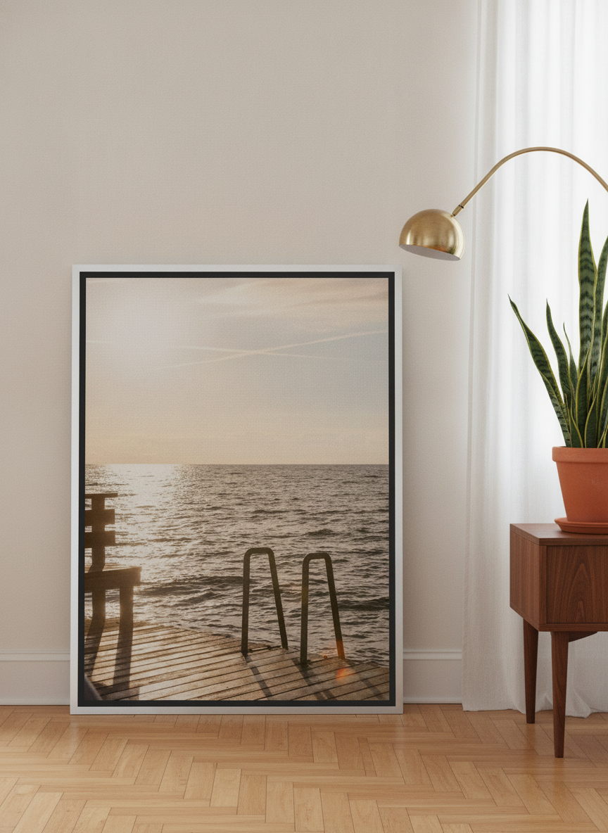 Canvas wall art with a silver leaf surround leaning against the wall in a mid-century living room