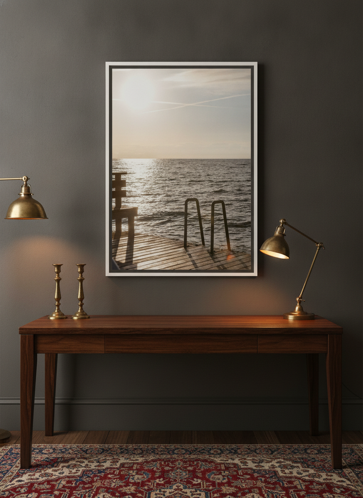 Canvas wall art with a white surround styled on the wall in a moody home office