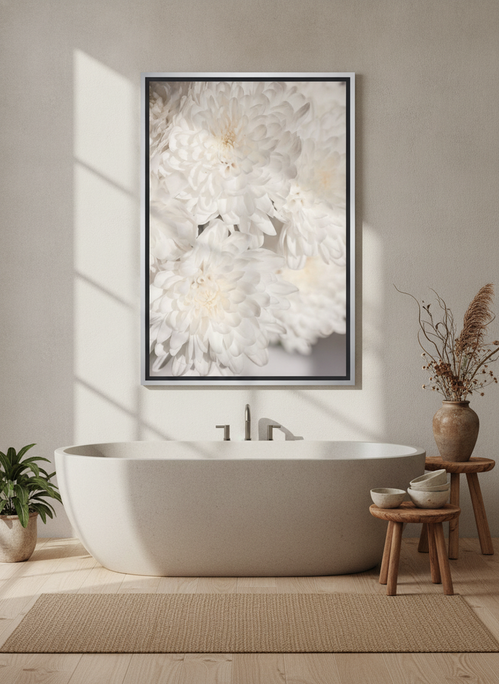 Canvas wall art with a silver leaf surround styled on the wall in a warm Japandi bathroom