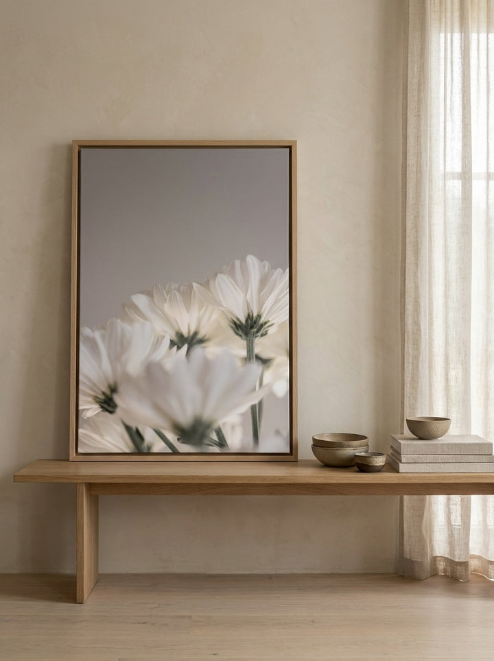 Canvas wall art with a natural timber surround standing on a bench in a warm Japandi bathroom