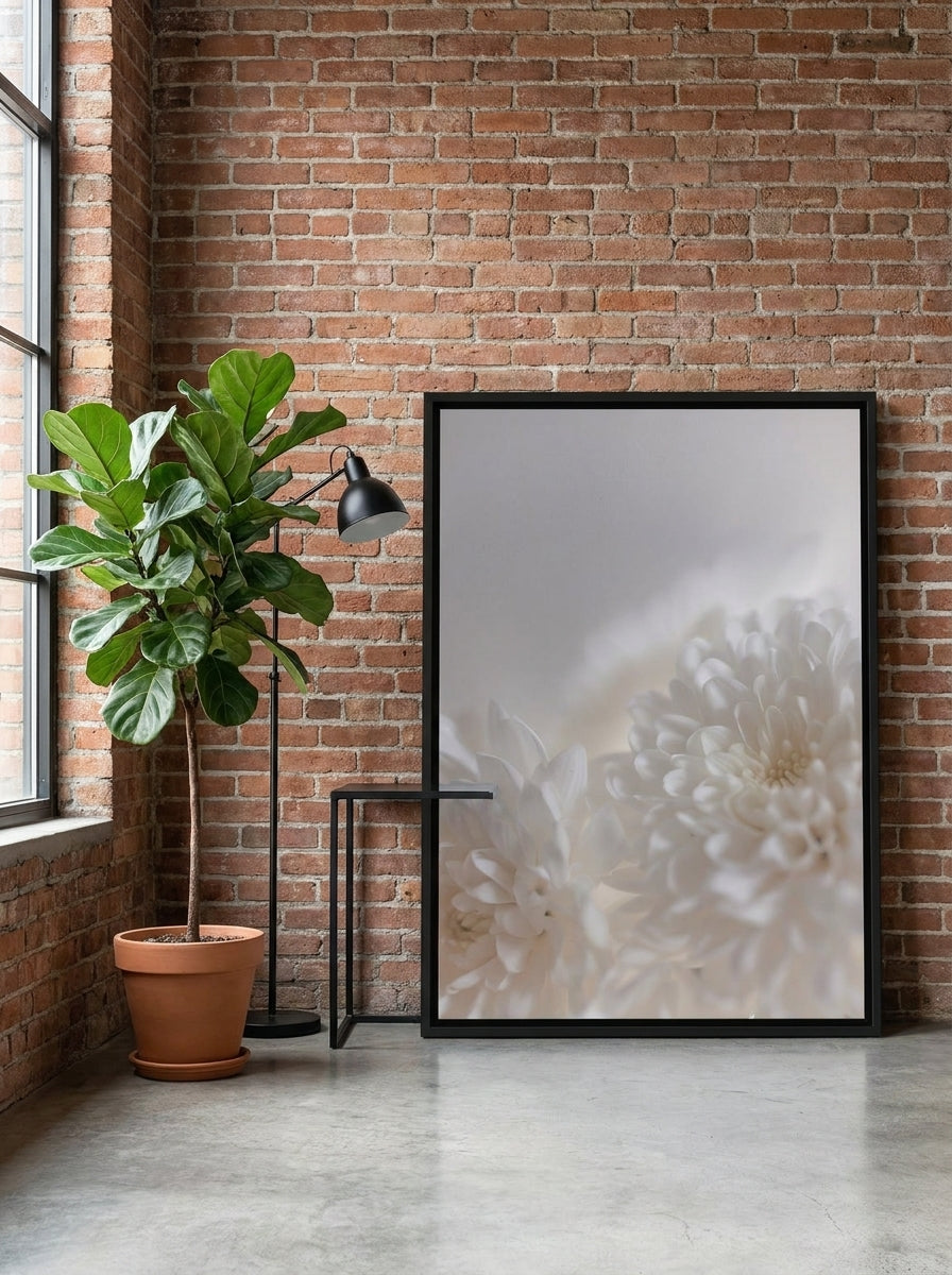 Canvas wall art with a black surround leaning against the wall in an industrial loft dining room