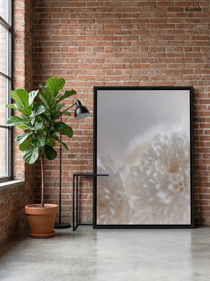 Canvas wall art with a black surround leaning against the wall in an industrial loft dining room