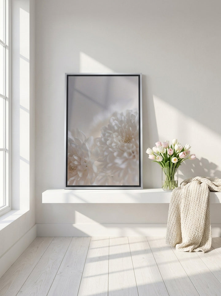 Canvas wall art with a silver leaf surround standing on a shelf in a bright Scandinavian bathroom