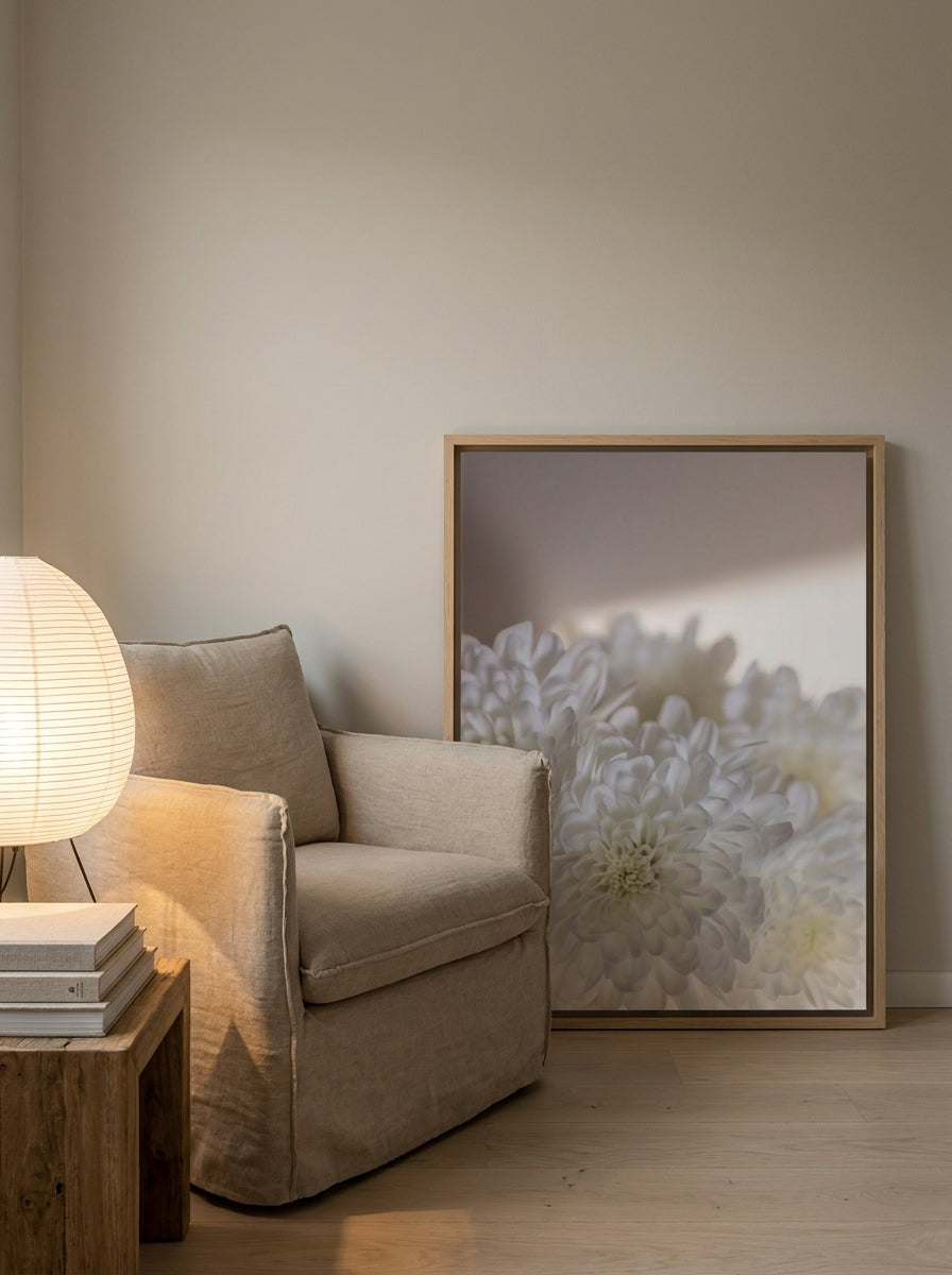 Canvas wall art with a natural timber surround leaning against the wall in a warm Japandi bathroom
