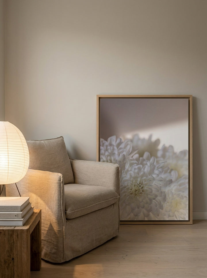 Canvas wall art with a natural timber surround leaning against the wall in a warm Japandi bathroom