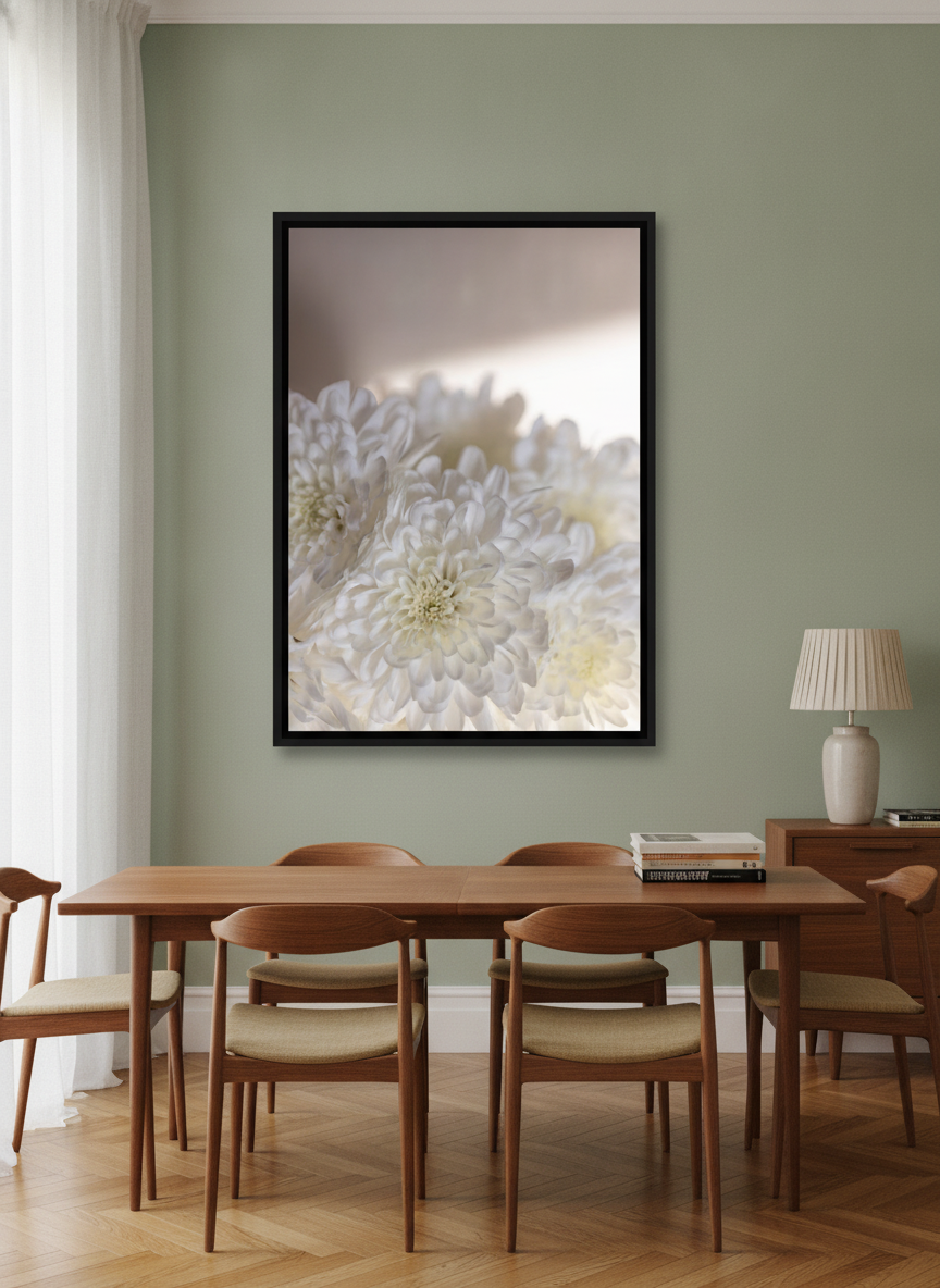 Oversized statement canvas wall art with a black surround styled on the wall in a mid-century dining room