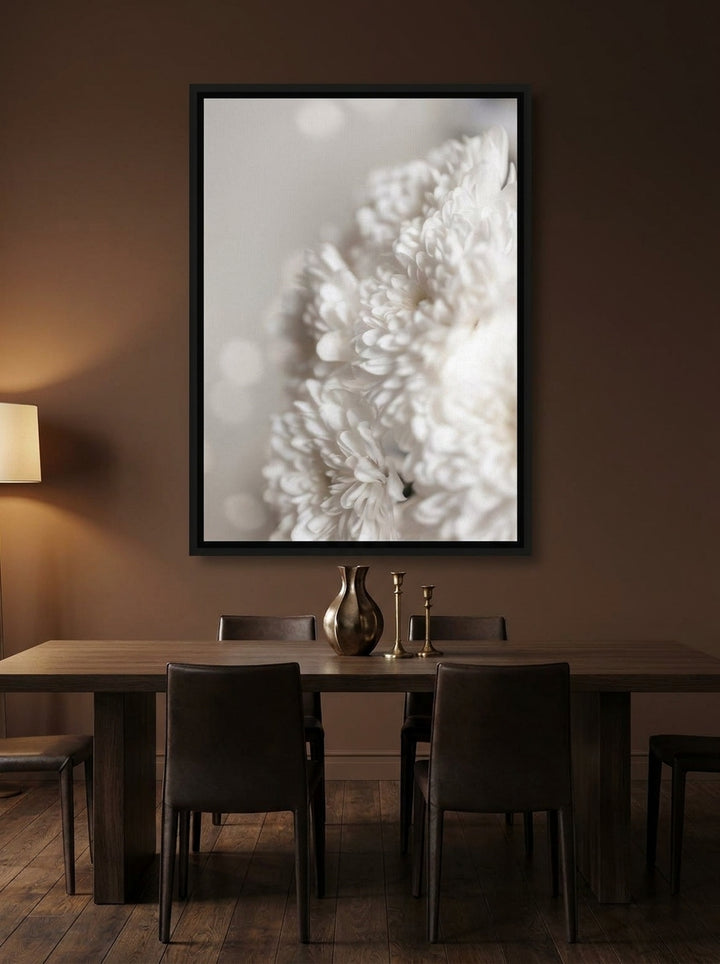 Canvas wall art with a black surround styled on the wall in a moody dining room