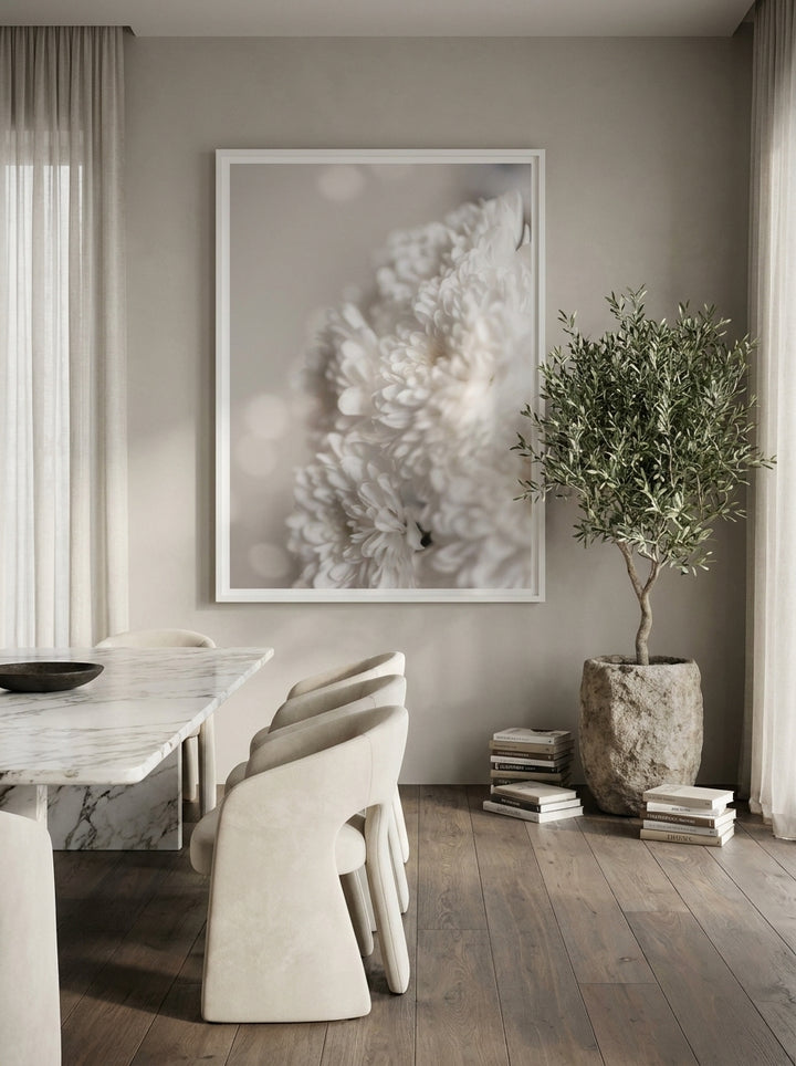 Oversized statement canvas wall art with a white surround styled on the wall in a luxe dining room