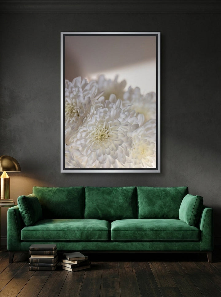 Oversized statement canvas wall art with a silver leaf surround styled on the wall in a moody living room
