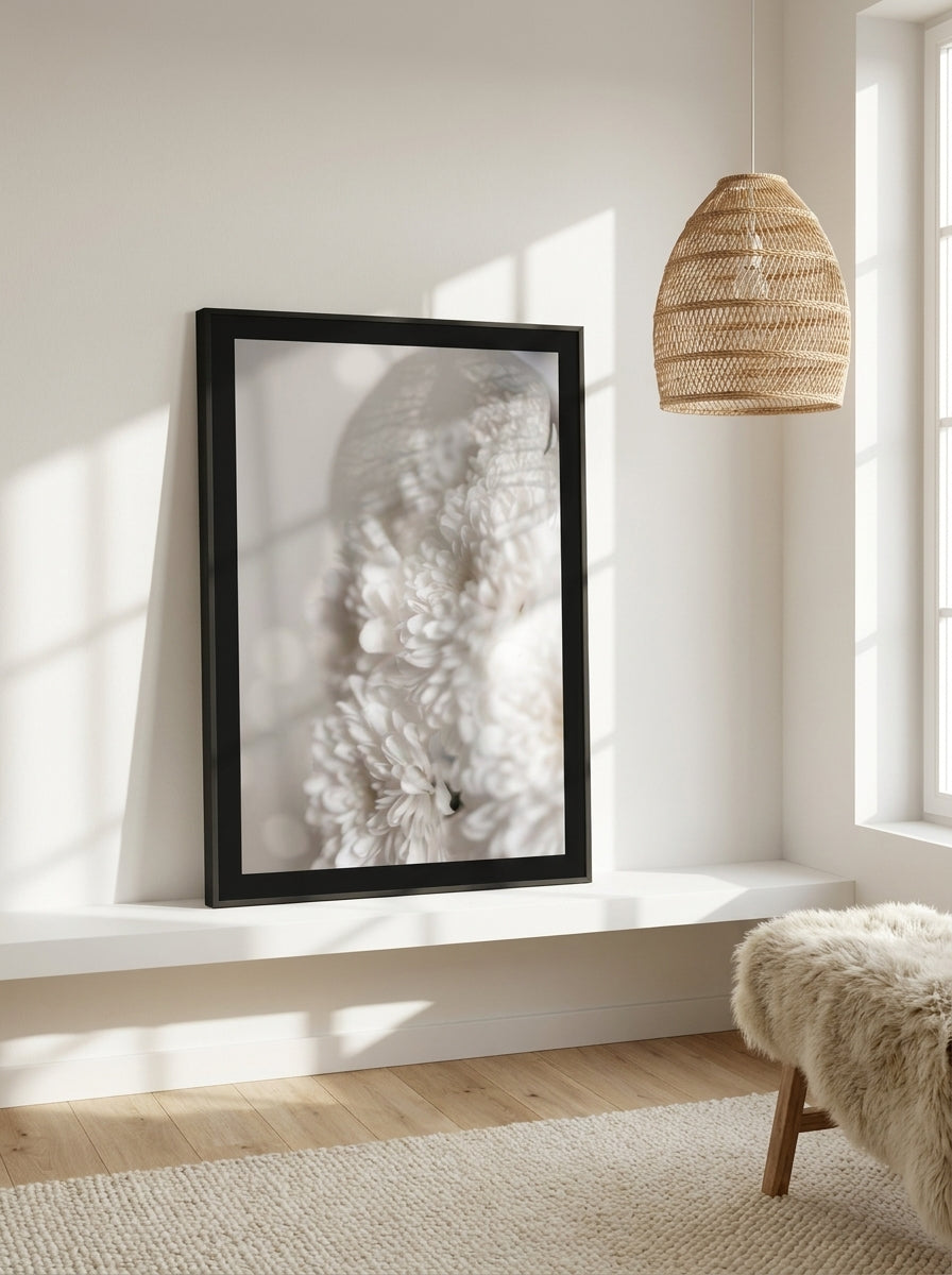 Modern wall art print standing on a shelf in a bright Scandinavian bathroom