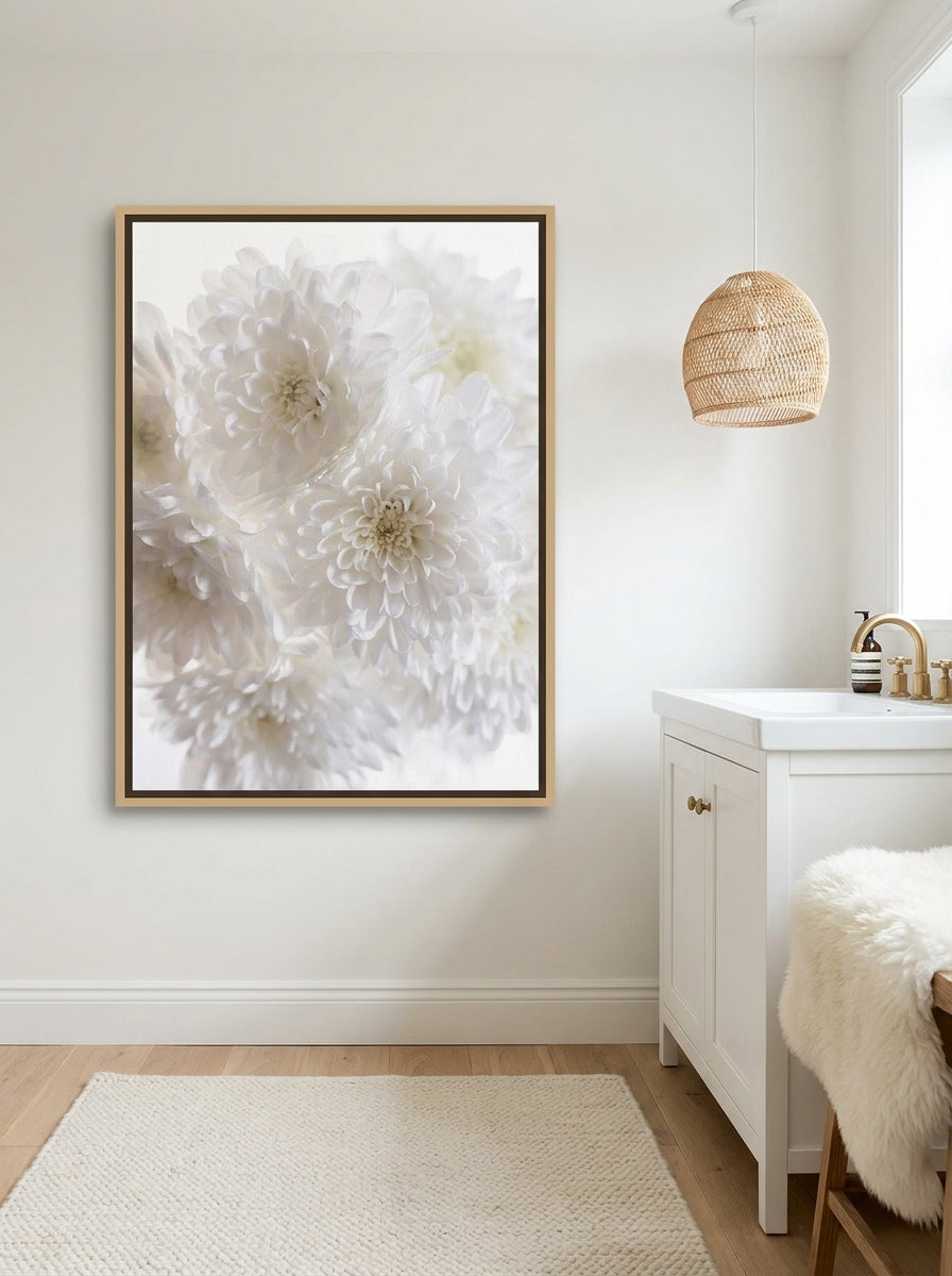 Canvas wall art with a natural timber surround styled on the wall in a bright Scandinavian bathroom