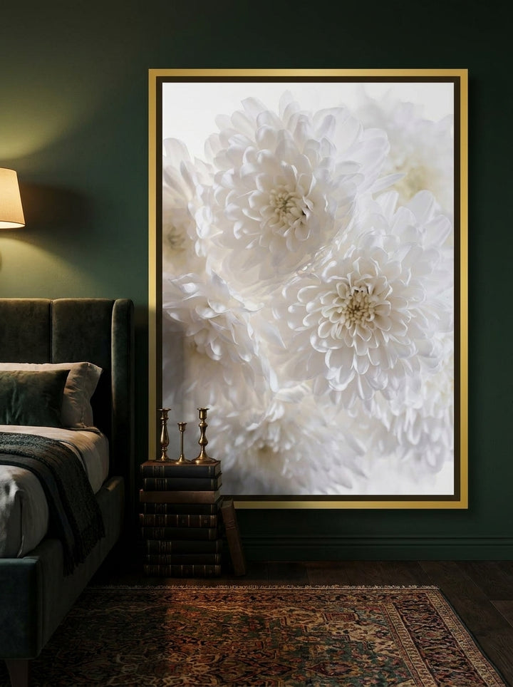 Canvas wall art with a gold leaf surround styled on the wall in a moody bedroom