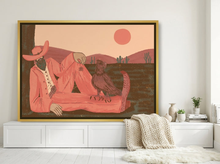 Canvas wall art with a gold leaf surround standing on a sideboard in a bright Scandinavian living room