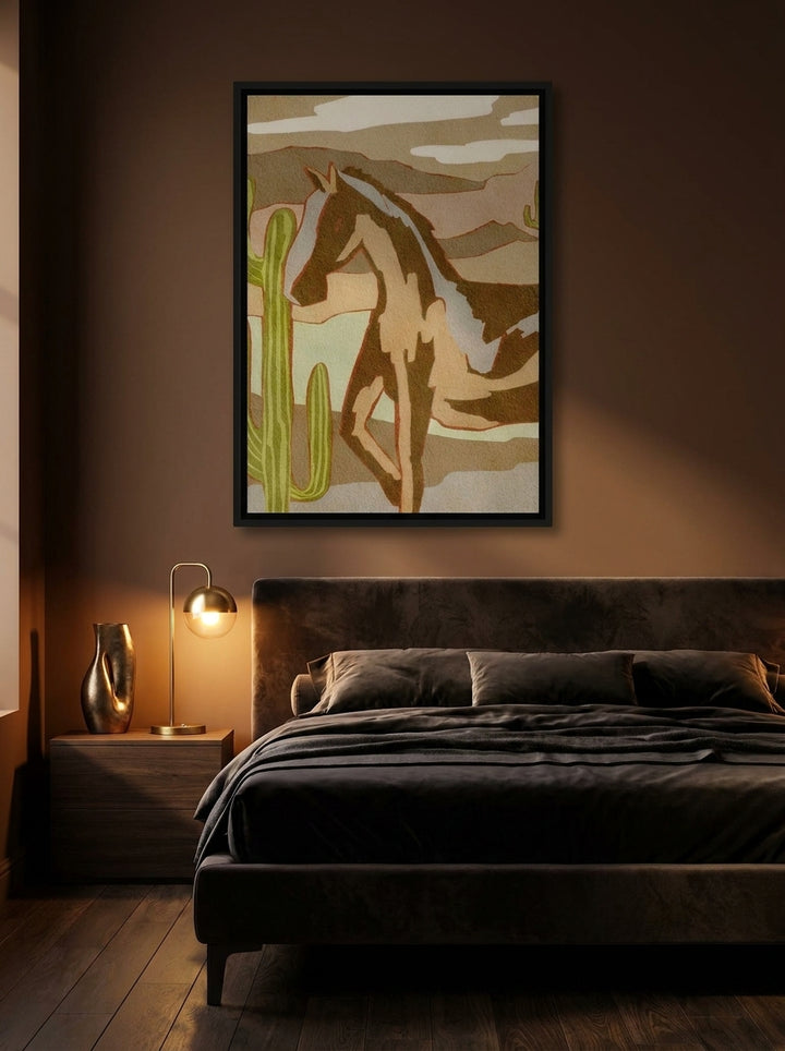 Canvas wall art with a black surround styled on the wall in a moody bedroom