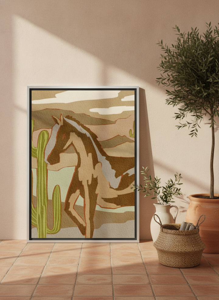 Canvas wall art with a silver leaf surround leaning against the wall in a Mediterranean bedroom