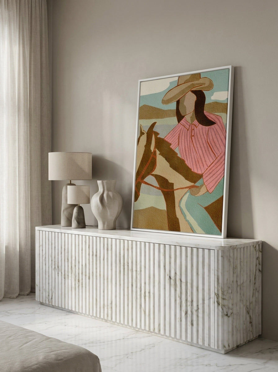 Canvas wall art with a white surround standing on a sideboard in a luxe bedroom