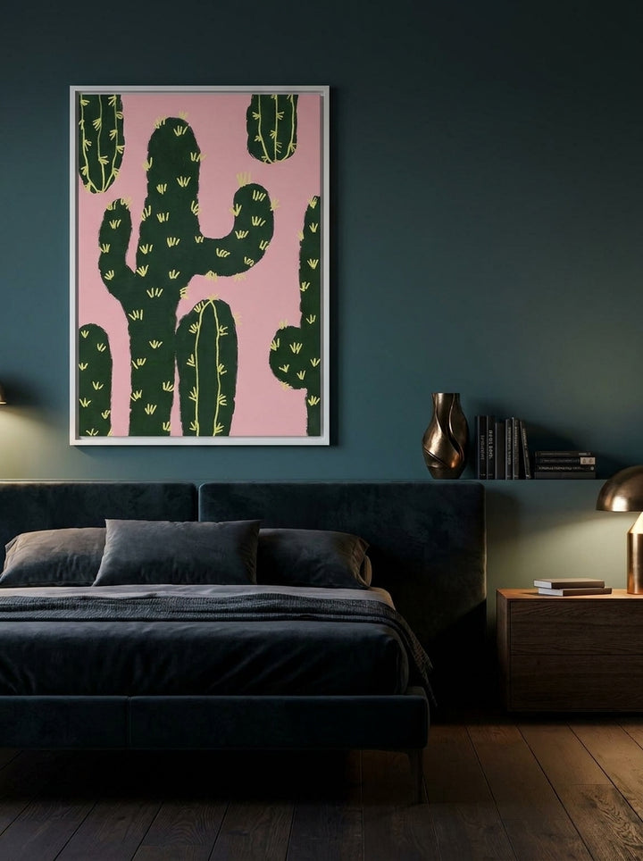 Canvas wall art with a white surround styled on the wall in a moody bedroom