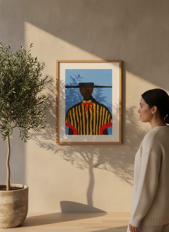 Person holding modern wall art print in a luxe living room