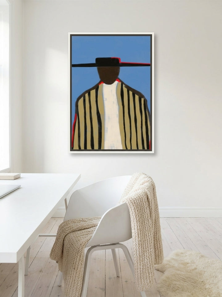 Canvas wall art with a white surround styled on the wall in a bright Scandinavian home office
