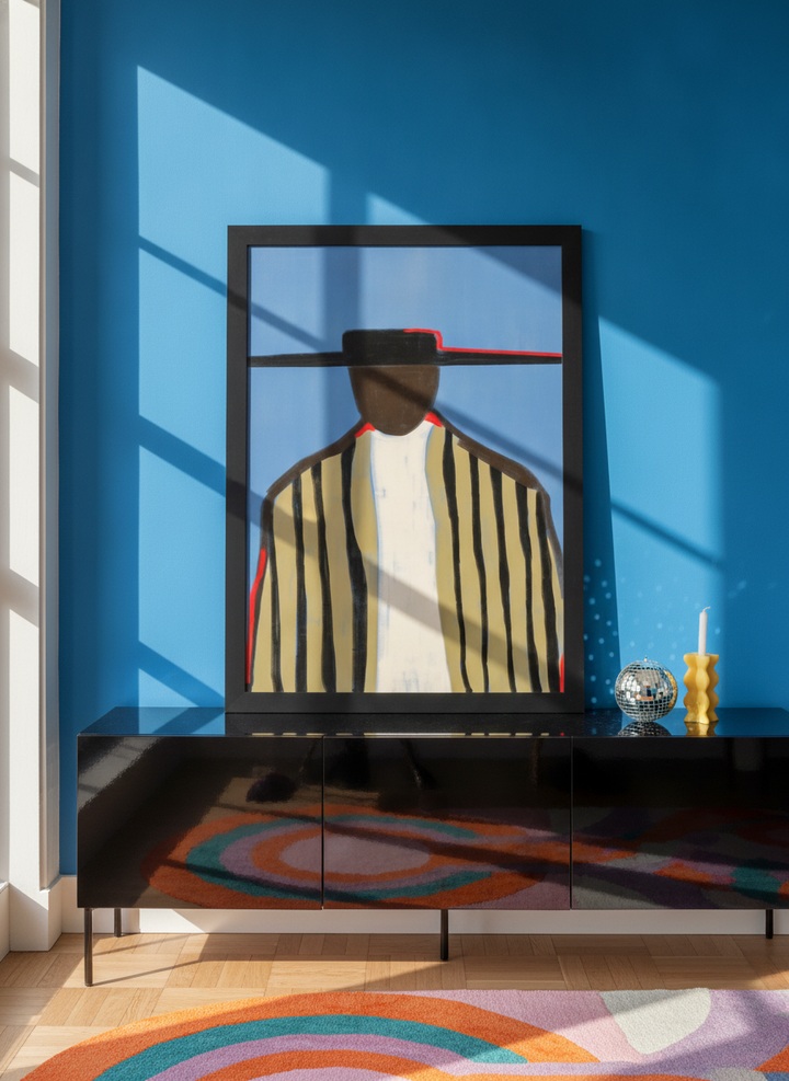 Modern wall art print standing on a sideboard in a colourful eclectic home office