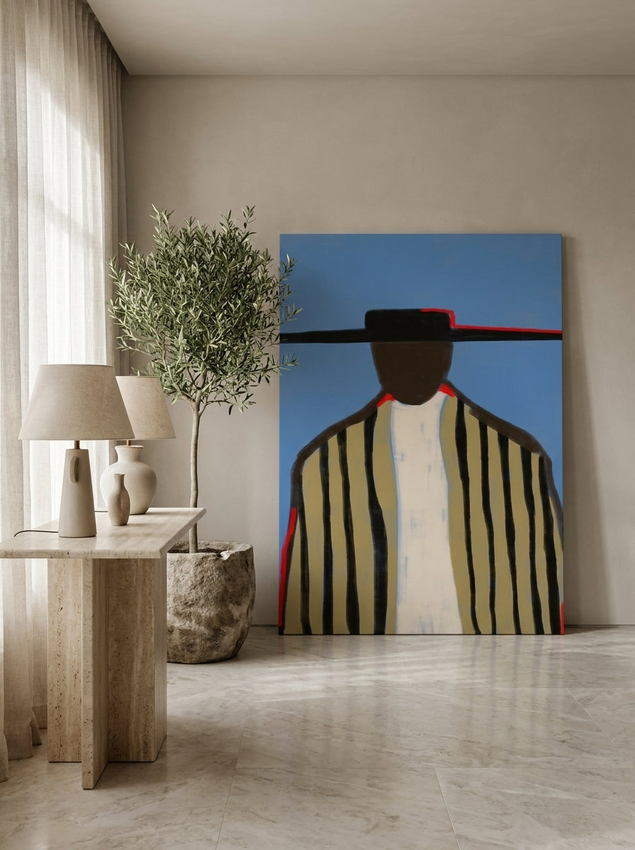 Stretched canvas wall art leaning against the wall in a luxe dining room