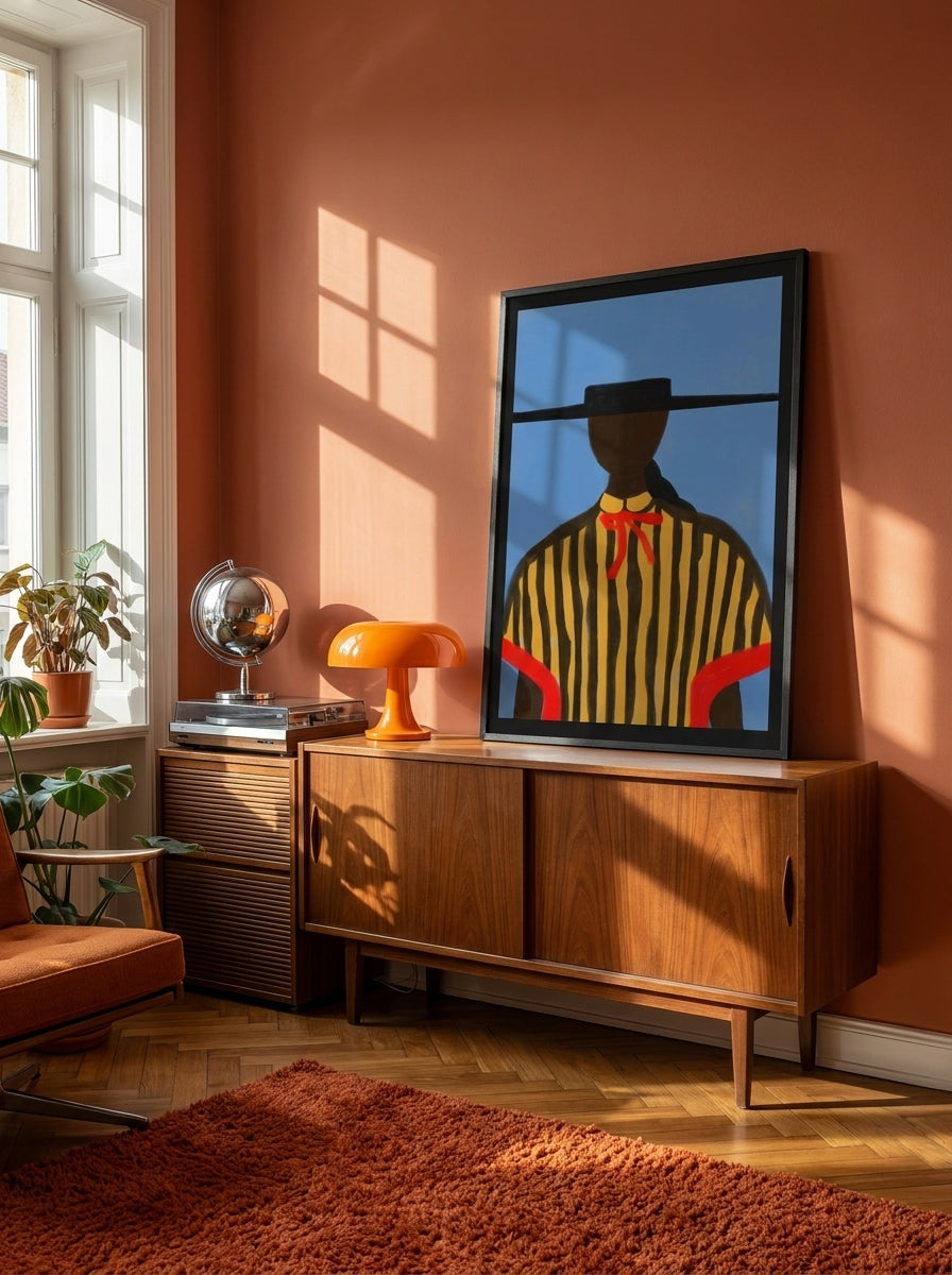 Modern wall art print standing on a sideboard in a retro 70s bedroom