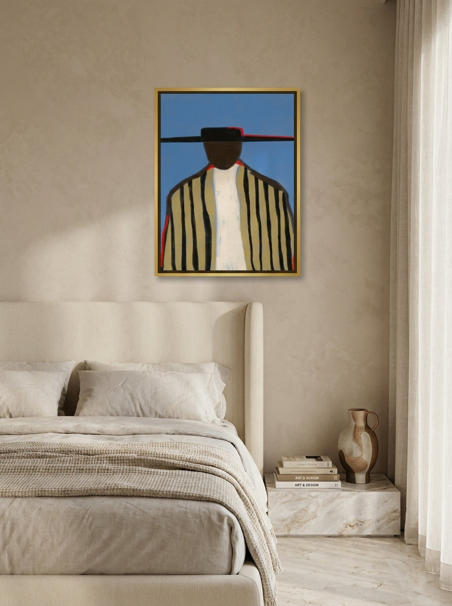 Oversized statement canvas wall art with a gold leaf surround styled on the wall in a luxe bedroom