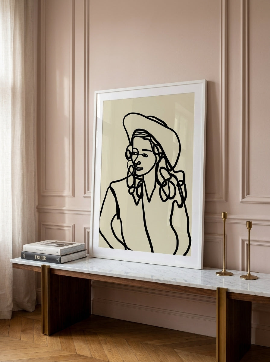 Modern wall art print standing on a console in a Parisian home office