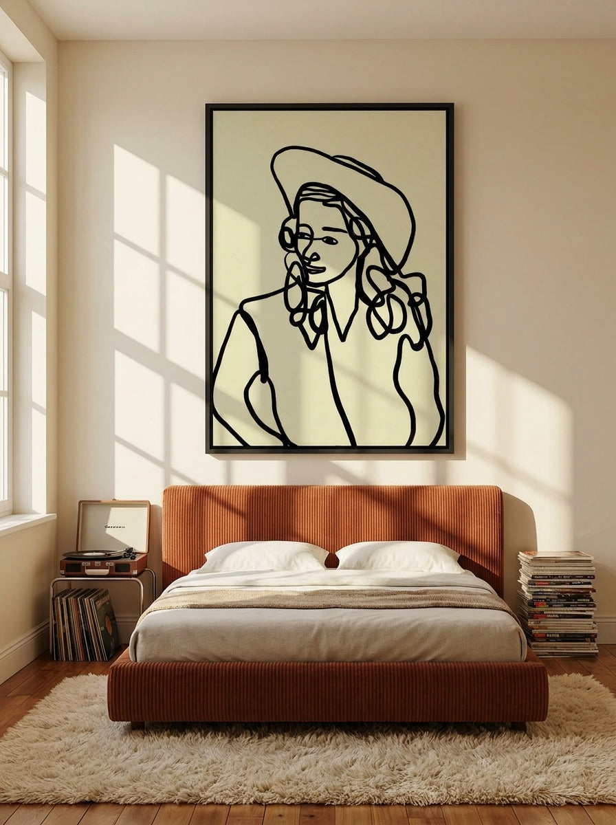 Canvas wall art with a black surround styled on the wall in a retro 70s bedroom