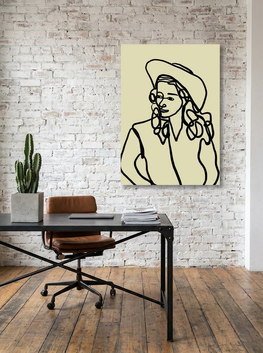 Stretched canvas wall art styled on the wall in an industrial loft home office