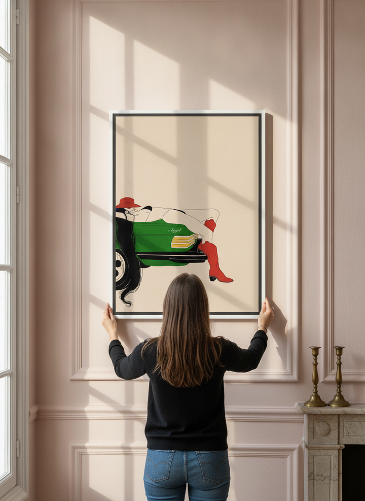 Person holding canvas wall art with a white surround in a Parisian living room