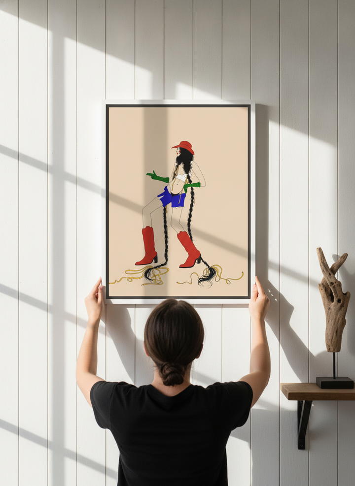 Person holding canvas wall art with a white surround in a coastal living room