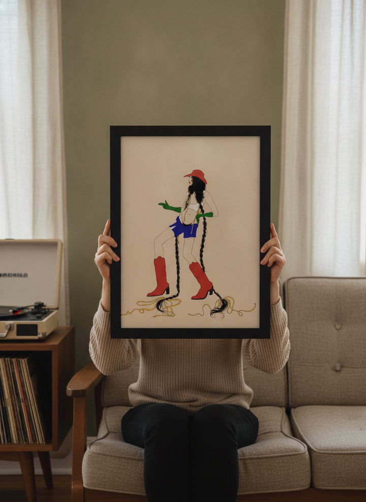 Person holding modern wall art print in a mid-century living room